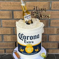 Corona beer bucket birthday cake with ice, lime and bottle topper for Jesse